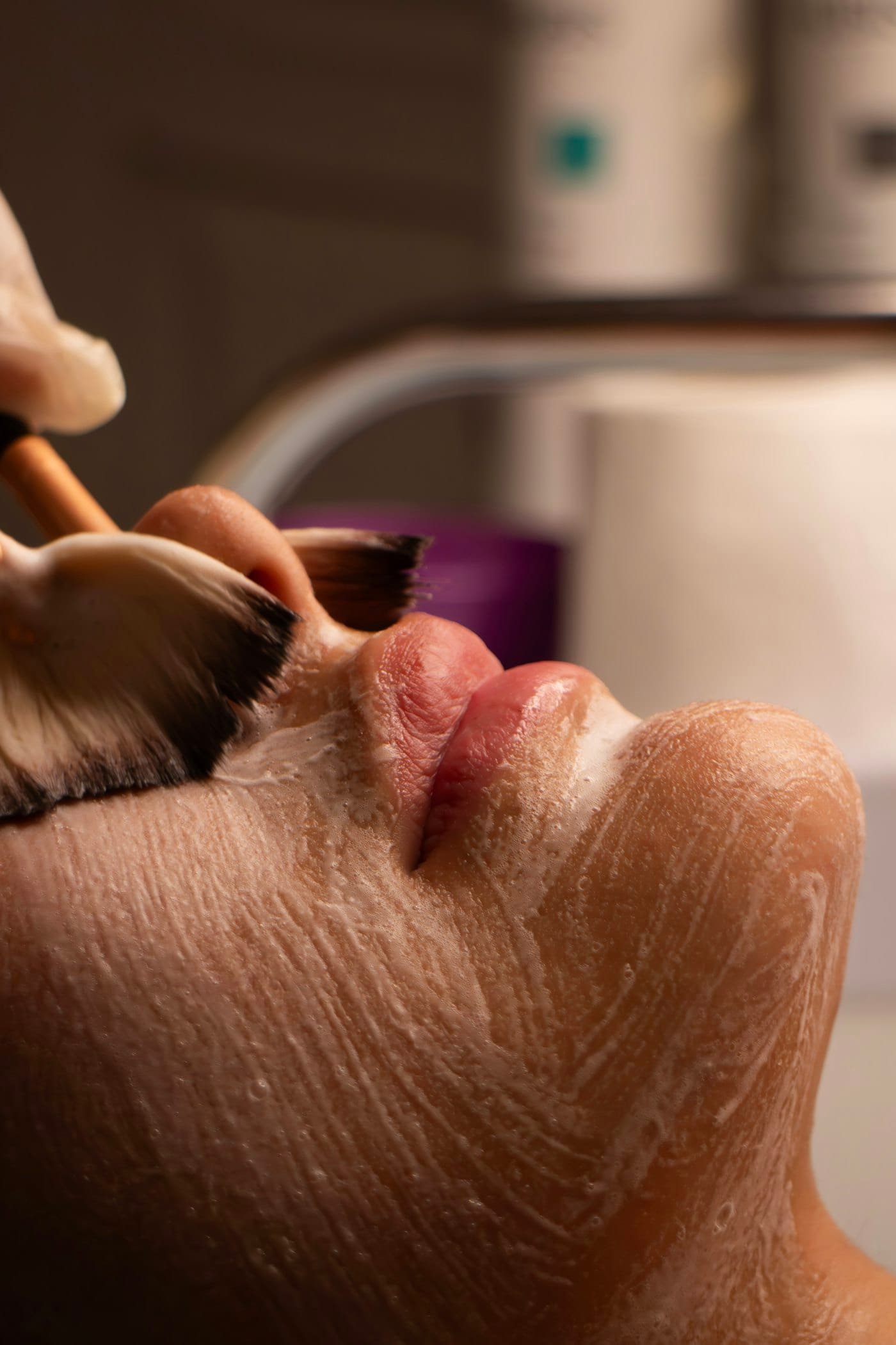 A treatment brush applying a product to the skin