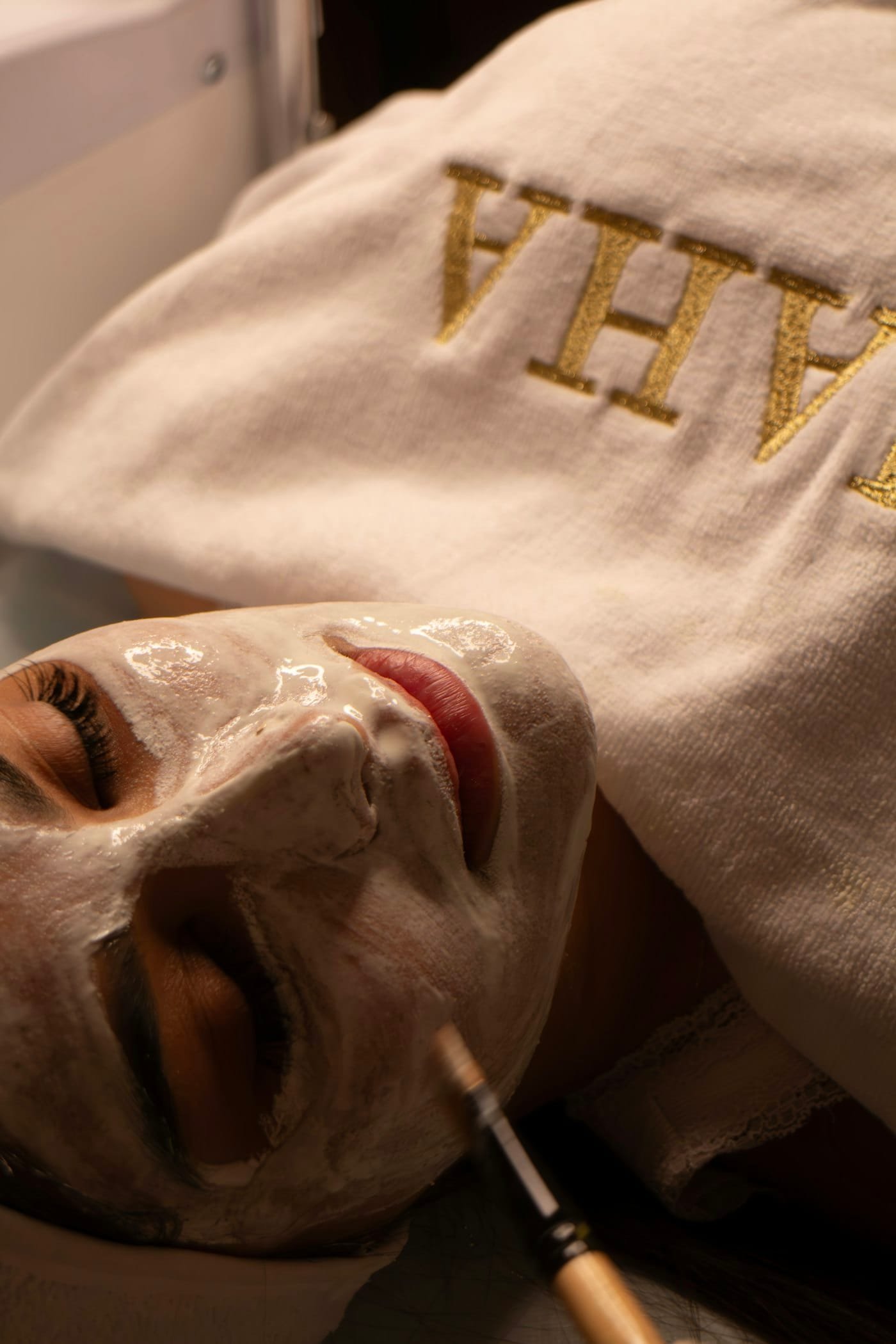 A hydrating mask being applied during a facial