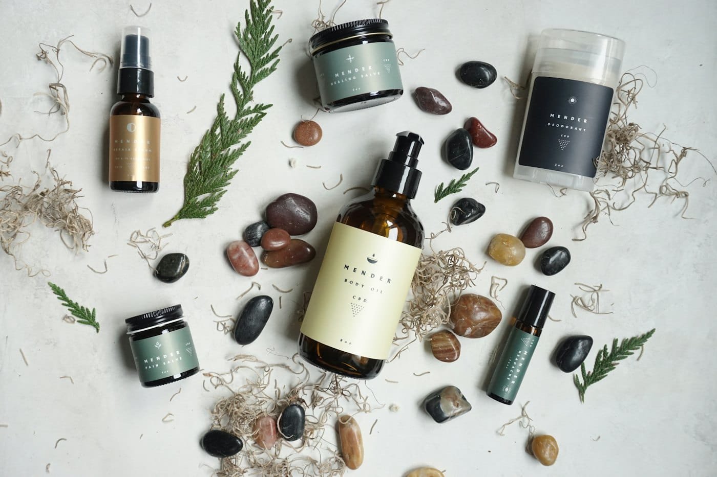 Skincare products among smooth stones