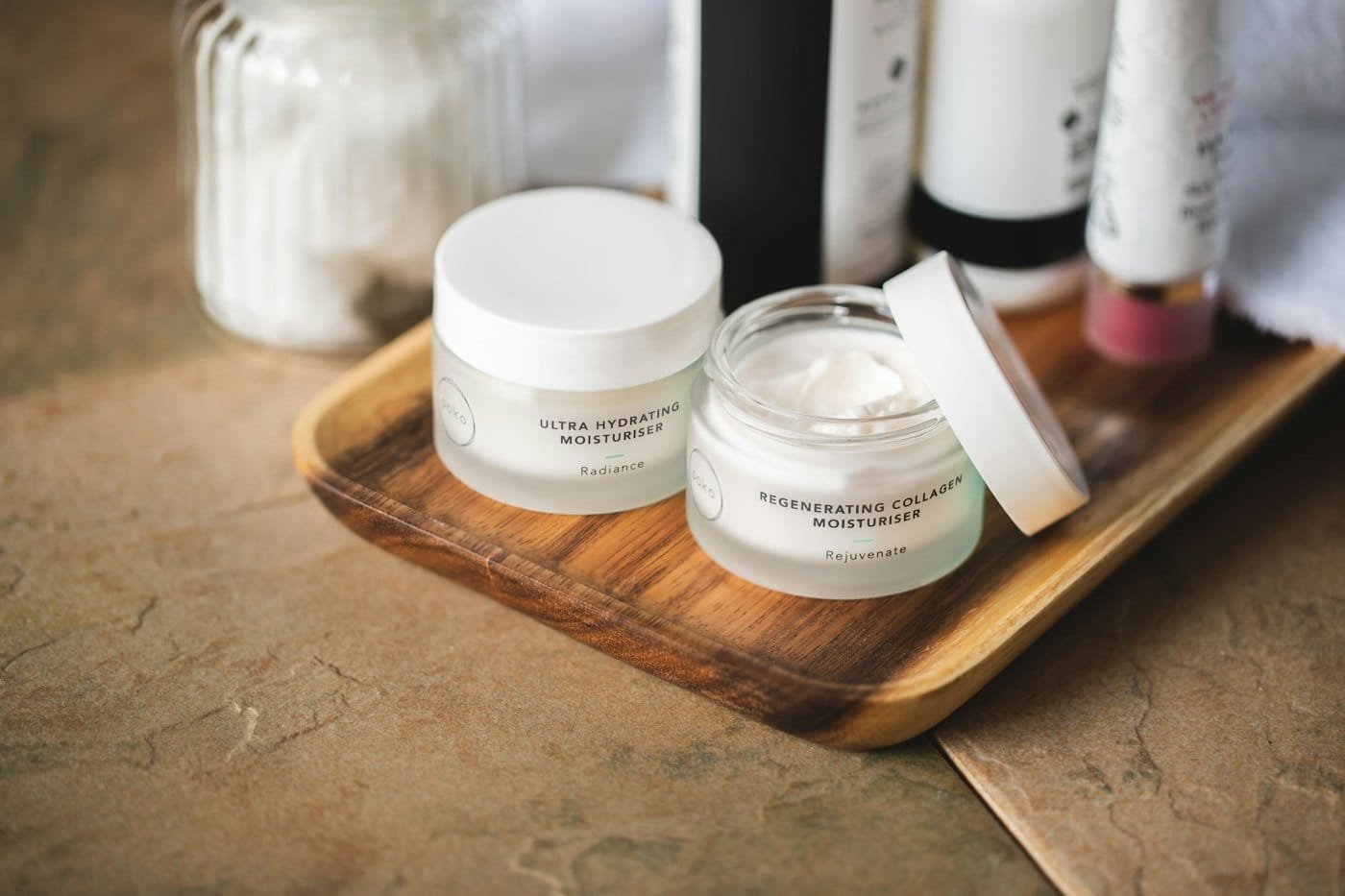 Professional skincare products laid out on a tray before a treatment